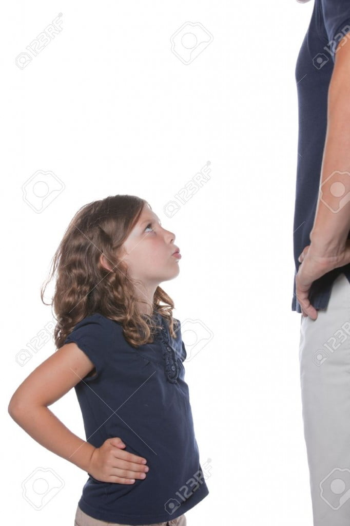 8255560-A-cute-sassy-little-girl-shows-she-is-upset-during-a-conflict-with-her-parent-father-Stock-Photo